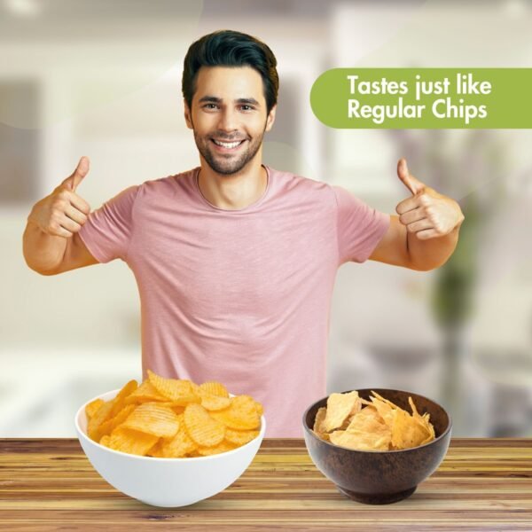 Smiling man giving thumbs up with bowls of regular potato chips and Diahealth Sugar Control Chips on table, text reads 'Tastes just like Regular Chips'