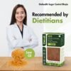 Female dietitian recommending Diahealth Sugar Control Bhujia Chilli Pepper variant with bowl of bhujia and low GI label